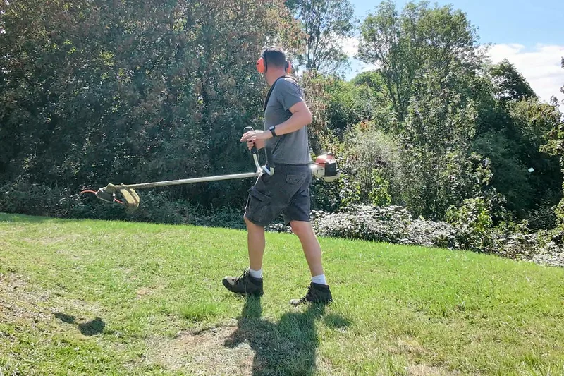 Strimming a grass bank